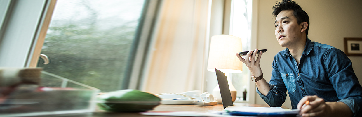 A man feeling worry when he listening to the call; image used for China Police Scam.